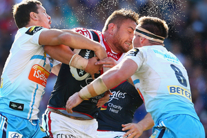 Jared Waerea-Hargreaves of the Roosters is tackled during the round 25 NRL match between the Sydney Roosters and the Gold Coast Titans. Photo / Getty Images.