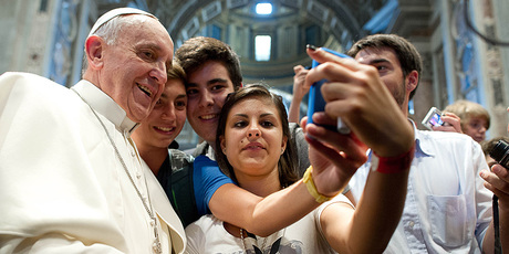 Pope Francis poses for a 'selfie'. Photo / AP