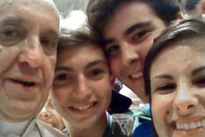 Pope Francis posed for this 'selfie' with a group of teenagers. Photo / AP