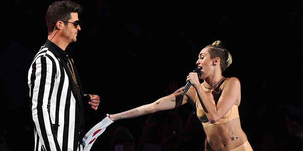Robin Thicke performs with Miley Cyrus at the VMAs. Photo / AP