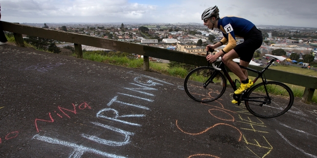 Jonty Morreau from Auckland Grammar School powers up Mt Wellington in the Hill Climb, during the New Zealand Secondary Schools Individual Cycling Championships. Photo / Brett Phibbs
