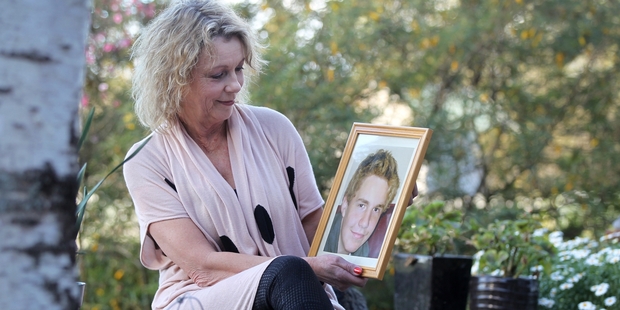 Cherie Adams with a photo of her son Corey, who committed suicide on June 20, 2011. Photo / Duncan Brown