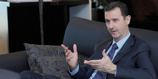 Syrian President Bashar Assad says he'll destroy his chemical weapons - but only if threats of military action from the US cease. Photo / AP