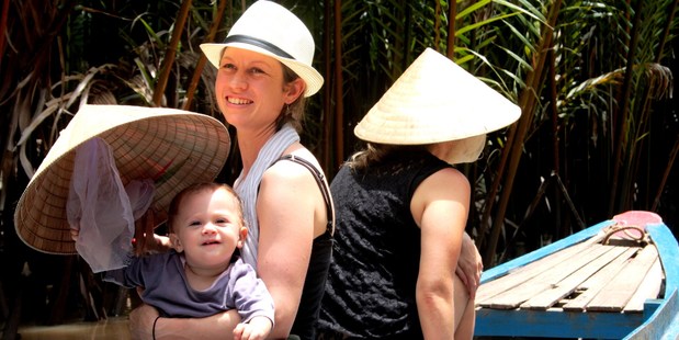 Kirsten Johnstone and Mia paddling up a Mekong Delta tributary. Photo / Dan Addington