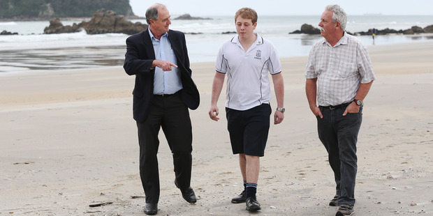 Te Puke High School student Scott Callaghan (centre) has invented a home-based wireless disaster warning system. Photo / Joel Ford