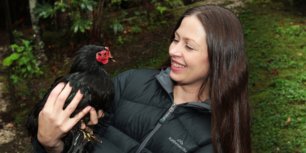 Tammy Downes washes her hands after touching her chickens. Photo / Doug Sherring