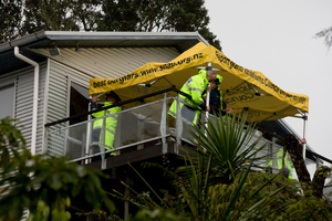 Police at the scene of the property on Takahe Road, Titirangi, West Auckland. Photo / NZ Herald
