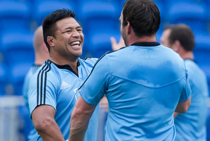 Keven Mealamu and Andrew Hore warm up at the All Blacks' team practice at Trusts Stadium in West Auckland last night. Photo / Greg Bowker