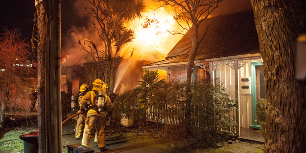 The Grafton house was well ablaze when firefighters showed up. Photo / Bradley Ambrose
