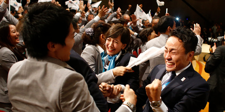 Members of the Tokyo delegation celebrate beating Istanbul and Madrid for the honour. Photo / AP