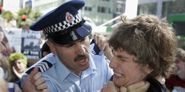 A police sergeant holds a protester in a neck grip during a protest in Auckland against the occupation of Iraq. Photo / Herald on Sunday