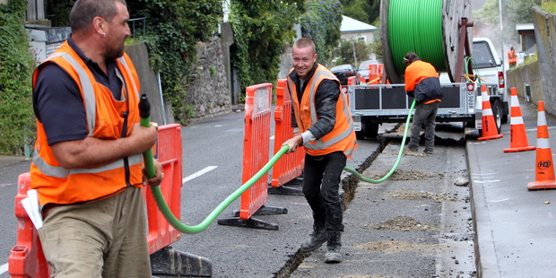 Contractors laying out fibre optic cable in Napier. Lines company Chorus has defended claims that changes to internet pricing equate to a $600m 'tax'. Photo / Glenn Taylor