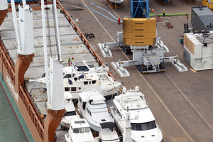 Port crews had to shift several boats and launches to shore before they could unload two new cranes. Photo / Paul Taylor