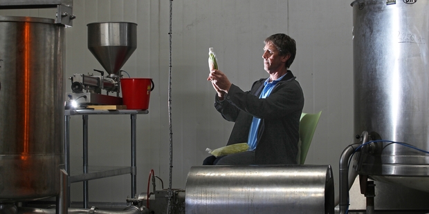 Colin Elder inspects the product at his new production facility in Tauranga. Photo / John Borren