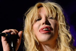 Courtney Love sticks her tongue out as she performs at Vinyl. Photo / AFP
