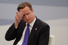 British Prime Minister David Cameron reportedly left his red box with his ministerial files unattended on a train, although his office says his security detail was right there. Photo / AFP