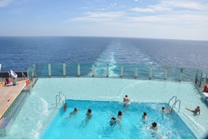 Passengers using the swimming pool aboard the MSC Preziosa.
