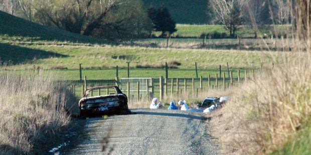 Justin Conrad McFarlane's 1992 Mitsubishi GTO two-door red sedan car registration number YE4901 was found extensively burnt on Serpentine Rd, Maheno. Photo / Rebecca Ryan