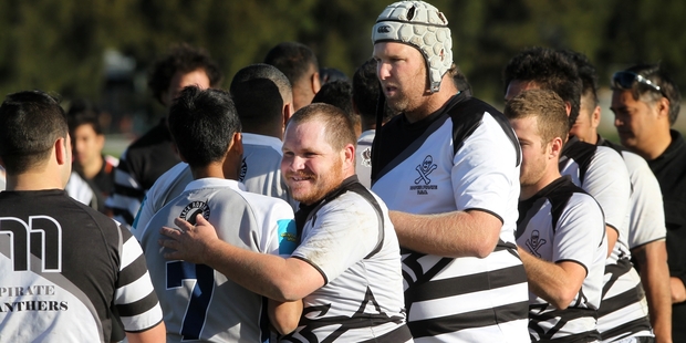 Napier Pirate Panthers players shake hands with OutKast counterparts moments after fighting finished their match early on Saturday. Photo / Duncan Brown
