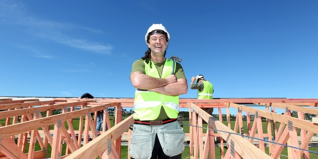 Bishop Justin Duckworth helps out at the Habitat for Humanity house in Manukau yesterday. Photo / Chris Gorman