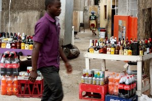 Stacks of liquor are sold on the streets of Maputo, Mozambique. Photo / AFP
