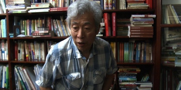 Former professor Sun Wenguang talking in his home in Jinan, east China.