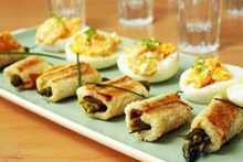 Stuffed eggs and toasted asparagus rolls. Photo / Food Hub