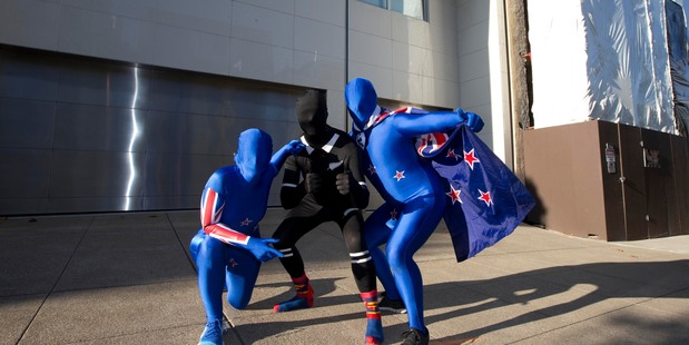 The ninja attackers (L-R) Cathy Odgers, Paul Holmes and Dan Welton back at Oracle owner Larry Ellison's 'party house' home where they decorated it with New Zealand flags. Photo / Brett Phibbs
