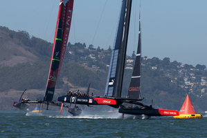 Oracle Team USA gets to the 1st mark ahead of Emirates Team New Zealand, Oracle went on to win Race 12 of the America's Cup. Photo / AP.