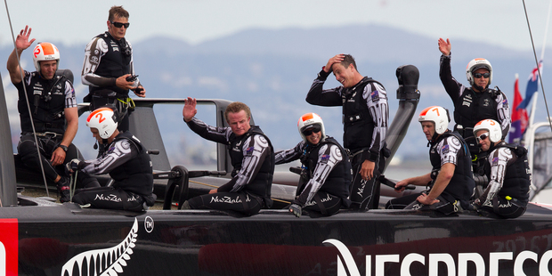 Team NZ crew put a brave face on their disappointment after losing to Oracle in race 13. Photo / Brett Phibbs