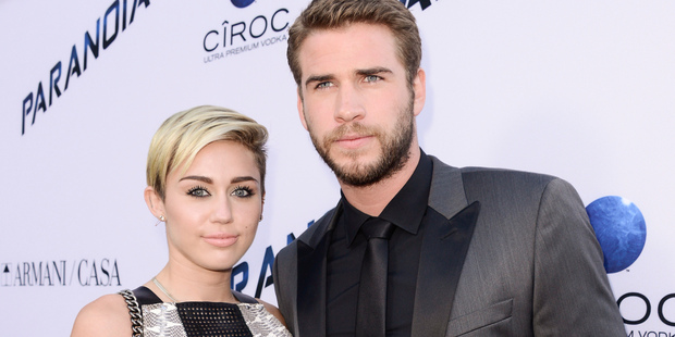 Miley Cyrus and Liam Hemsworth have split after Cyrus' risque performance at the VMAs. Photo / AP