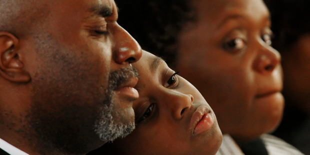 Black and white people joined in yesterday's memorial service at the 16th Street Baptist Church in Alabama _ a far cry from the segregated society in America 50 years ago. Photo / AP