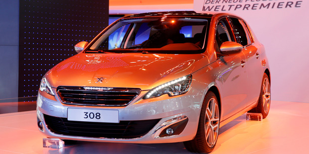 The new Peugeut 308 hatchback is displayed after its world premiere during the first press day of the 65th Frankfurt Auto Show. Photo / AP