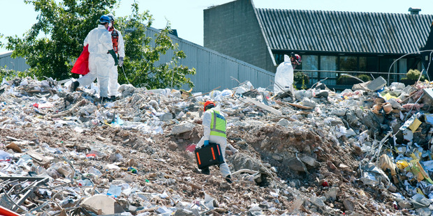 Emergency workers on the site of the Pyne Gould Corporation building in March, 2011. Photo / David Alexander
