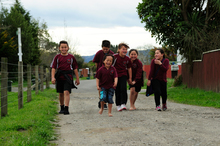 Ruatoki school-children make their way home. Photo / Peter Quinn