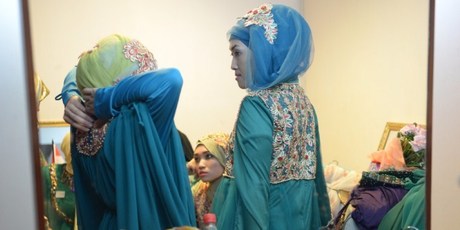 Contestants of the Muslimah World pageant prepare backstage for the grand final of the contest in Jakarta. Photo / AFP