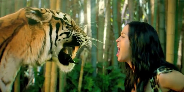 Katy Perry stars alongside a tiger in her video for her hit single Roar. Photo / YouTube