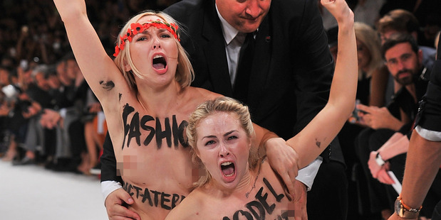 Topless activists disrupt a Nina Ricci show during Paris Fashion Week.Photo / Getty