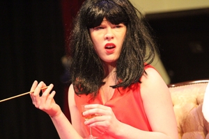 ENIGMATIC: The Countess (Simone Sail) reacts while the characters of Bloody Murder discuss the mindset of the writer who wrote them into a work of murder-mystery fiction.