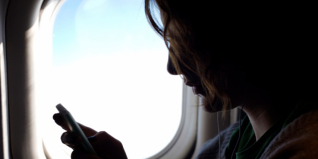 Currently, passengers are required to turn off their smartphones, tablets and other devices once a plane's door closes. Photo / Thinkstock