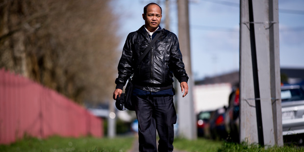 Burmese grandfather Lian Pu Taithul walks for two hours each day to study as he can't afford the bus. Photo / Dean Purcell