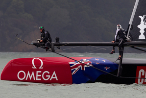 Emirates Team New Zealand adjust their headsail before their postponed duel with Oracle Team USA today. Photo / Brett Phibbs