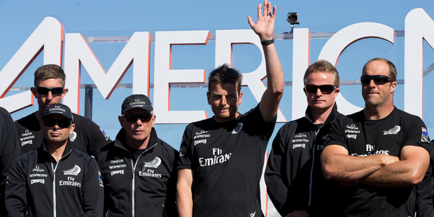 Emirates Team New Zealand skipper Dean Barker with his team at the cup presentation. Photo / Brett Phibbs