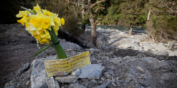 A tribute to Connor Hayes and Joanna Lam left by the Haast community on the Haast Pass, where the couple were swept off the road. Photo / Christine Cornege