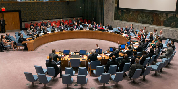 Delegates vote on a resolution in the United Nations Security Council. Photo / AP