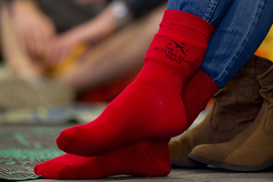 Emirates Team New Zealand fans wear lucky red socks.Photo / Richard Robinson