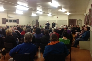 Tauranga City Councillor Rick Curach speaks to a near-full Matua Hall at last night's Meet the Candidates meeting. Photo / Kiri Gillespie