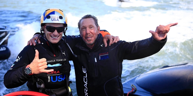 Oracle's Larry Ellison, enjoying with skipper Jimmy Spithill (left) their victory yesterday, describes the AC72s as "amazing". Picture / Oracle
