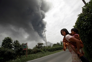 The slowdown in global warming has been partly attributed to particles from erupting volcanos such as Mt Sinabung in North Sumatra, Indonesia. Photo / AP