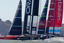 Oracle Team USA beats Emirates Team New Zealand to the first mark in Race 14 of the America's Cup. Photo / Brett Phibbs